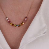 Close-up of 18ct rose gold necklace showcasing multicolour tourmalines, available at York Jewellers Penrith.