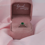 Claw set 18ct white gold ring with natural oval shaped emerald gemstone available at York Jewellers Penrith and Warriewood (Sydney).