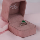  18ct white gold ring featuring natural oval shaped emerald and tapered baguette diamonds available at York Jewellers Penrith and Warriewood (Sydney).