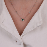 Close-up of 18ct white gold necklace showcasing an emerald and diamonds, available at York Jewellers Penrith.