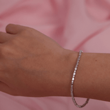 Detail of 18ct white gold diamond bracelet showing the polished finish and varied diamond shapes.