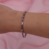 Close-up of 18ct white gold bracelet showcasing rubies and diamonds, available at York Jewellers Penrith.