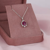 18ct white gold fancy halo pendant featuring natural oval ruby and diamond detailing available at York Jewellers Penrith and Warriewood (Sydney).