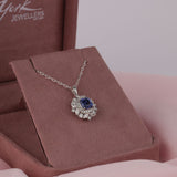 18ct white gold fancy halo pendant featuring natural square emerald cut blue sapphire and diamond detailing available at York Jewellers Penrith and Warriewood (Sydney).