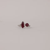 Top view of 18ct white gold split ring showcasing the two natural rubies and split band silhouette.