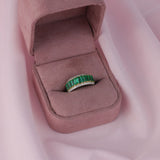  18ct white and yellow gold ring featuring 11 natural emerald cut emeralds and round brilliant cut diamonds available at York Jewellers Penrith and Warriewood (Sydney).