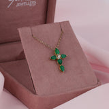 18ct yellow gold fancy cross drop pendant featuring natural emeralds and round brilliant cut diamond available at York Jewellers Penrith and Warriewood (Sydney).