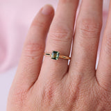 On-hand view of 18ct yellow gold ring showing four-claw setting holding Asscher cut sapphire available at York Jewellers Penrith (Sydney).
