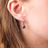 Pear-shaped London blue topaz earrings in 9ct rose gold, set in a claw setting with elegant shepherd hook fittings - York Jewellers Penrith