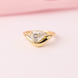 Elegant pear shaped diamond engagement ring in yellow gold Sydney Australia.