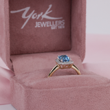 9ct yellow gold blue topaz and diamond halo ring available from Sydney fine jeweller York Jewellers.