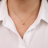 9ct yellow gold diamond dress pendant on model with 14 round brilliant cut diamonds in carcelated setting available at York Jewellers Sydney (Penrith and Warriewood).