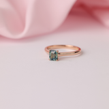 18ct rose gold solitaire ring featuring 1.02ct Madagascar greenish-blue sapphire in emerald cut four-claw setting available at York Jewellers Penrith and Warriewood (Sydney).