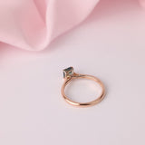 Underside profile view of 18ct rose gold four-claw setting holding emerald cut sapphire in-store at York Jewellers Penrith (Sydney).