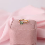 Asscher cut parti sapphire set in classic 18ct yellow gold solitaire ring on pink York Jewellers box, available in Penrith, Sydney.