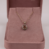 Close-up of yellow sapphire and grain-set diamond halo pendant in 18ct gold with fine detailing available at York Jewellers Sydney (Penrith and Warriewood).