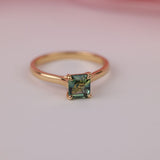 Close-up of Asscher cut parti sapphire with blue and green colour variation in yellow gold ring in-store at York Jewellers Penrith (Sydney).
