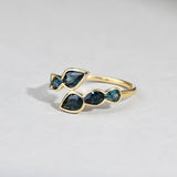 Close-up of 9ct yellow gold ring showcasing bezel set pear cut natural Australian blue sapphires, available at York Jewellers Penrith.