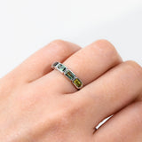 9ct white gold Athena Ring worn on hand showing a natural spread of emerald cut sapphire colour.