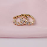 Elegant 9ct yellow gold hoop earrings with bezel set lab grown round brilliant cut diamonds, available online or in-store at York Jewellers Penrith and Warriewood (Sydney).