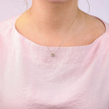9ct yellow gold Cancer diamond pendant worn at the collarbone showing the crab symbol and diamond detail.