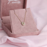 Close-up of 9ct yellow gold Cancer pendant showcasing 18 carcelated round brilliant cut diamonds (0.10ct total) available at York Jewellers Penrith.