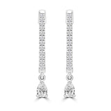 Front profile of 9ct white gold diamond huggie drop earrings showing the close-fitting huggie and drop silhouette.