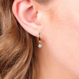 9ct yellow gold lab grown diamond huggie drop earrings worn on ear available at Penrith Sydney fine jeweller, York Jewellers.