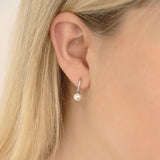 Close-up of 9ct white gold hoop earrings showcasing white pearls and diamonds set together, available at York Jewellers Penrith.