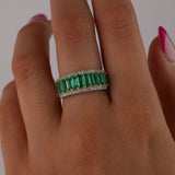 Close-up of 18ct white and yellow gold ring showcasing 1.66ct total natural emerald cut emeralds and diamond detail available at York Jewellers Penrith.