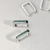 9ct white gold Jules Huggie Earrings with natural Australian teal sapphires available from Sydney fine jeweller York Jewellers.