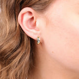 Close-up of 0.50ct EF/VS lab grown diamonds in 9ct yellow gold wide huggie earrings showing press set detail available at York Jewellers Penrith (Sydney).