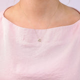 9ct yellow gold Leo diamond pendant worn at the collarbone showing the lion symbol and diamond detail.