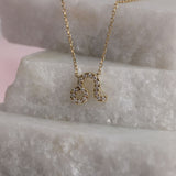 Personalised 9ct yellow gold Leo diamond pendant available from Sydney fine jeweller York Jewellers.