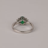 Underside of luxury 18ct white gold emerald and tapered baguette diamond ring, available at York Jewellers Penrith.