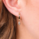 Close-up of 0.30ct EF/VS lab grown marquise diamonds in 9ct yellow gold bezel set huggie drop earrings available at York Jewellers Penrith and Warriewood (Sydney).