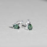 Close-up of 9ct white gold stud earrings showcasing pear cut natural Australian teal sapphires, available at York Jewellers Penrith.