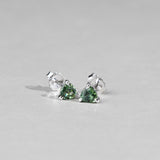 Close-up of 9ct white gold stud earrings showcasing trilliant cut natural Australian teal sapphires, available at York Jewellers Penrith.