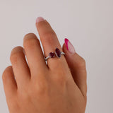 Close-up on hand of 18ct white gold ring showcasing 2.54ct total natural rubies and diamond detail available at York Jewellers Penrith.