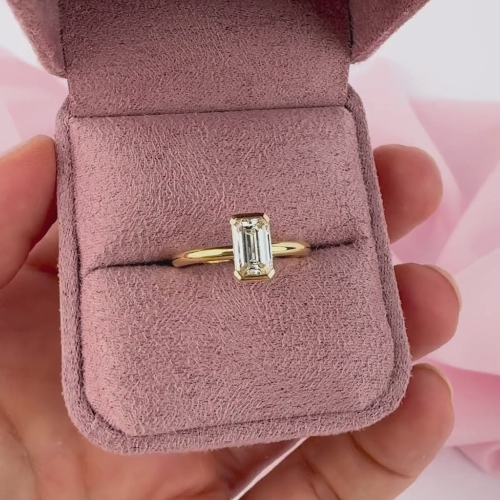 Elegant emerald cut diamond engagement ring in yellow gold Sydney Australia.