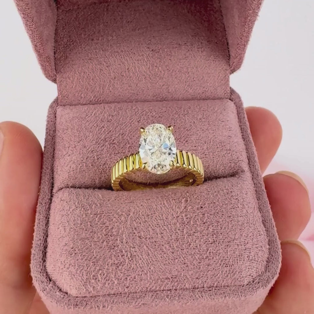 Oval shape diamond engagement ring on hand yellow gold Sydney Australia Stella ring.