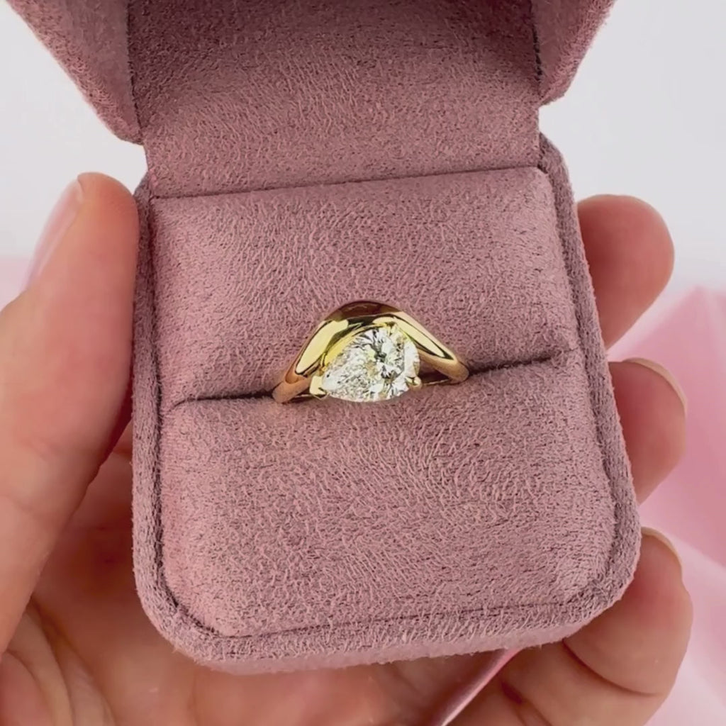 Pear shaped diamond engagement ring on hand yellow gold Sydney Australia Phoebe ring.