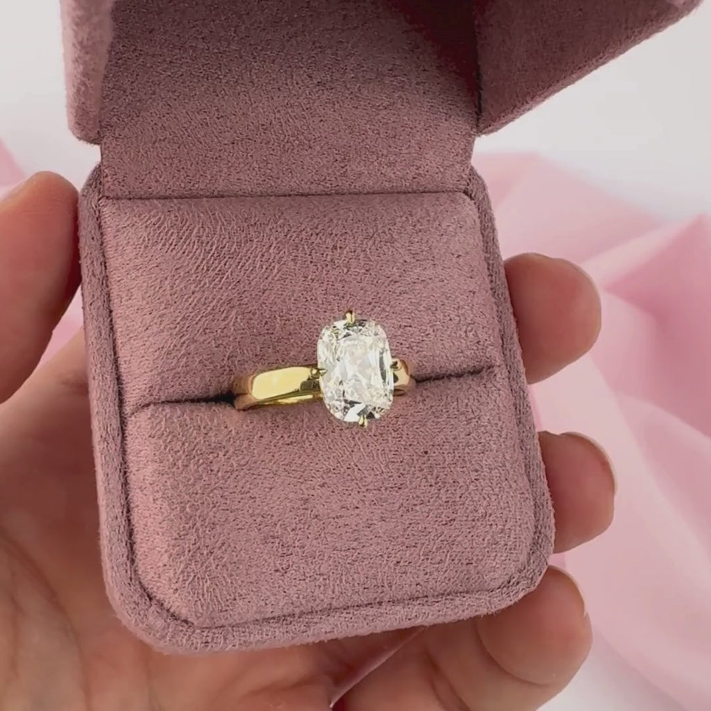 Carrie engagement ring side profile cushion cut diamond yellow gold setting.