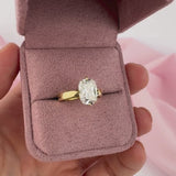 Carrie engagement ring side profile cushion cut diamond yellow gold setting.