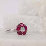 Elegant 18ct white gold ruby flower ring available from Sydney fine jeweller York Jewellers featuring natural rubies and diamonds.
