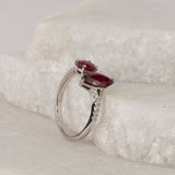 Side profile of 18ct white gold split ring showing natural rubies and diamond detailing along the band.