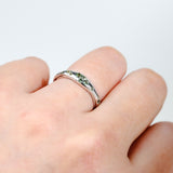 Close-up of 9ct white gold ring showcasing round brilliant cut natural Australian green sapphires, available at York Jewellers Penrith.
