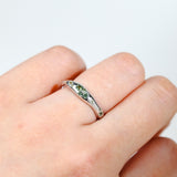 9ct white gold Saffron Ring worn on hand showing earthy, grounded green sapphire colour.