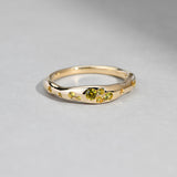 Close-up of 9ct yellow gold ring showcasing round brilliant cut natural Australian yellow sapphires, available at York Jewellers Penrith.