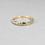 Close-up of 9ct yellow gold ring showcasing round brilliant cut natural Australian green sapphires, available at York Jewellers Penrith.